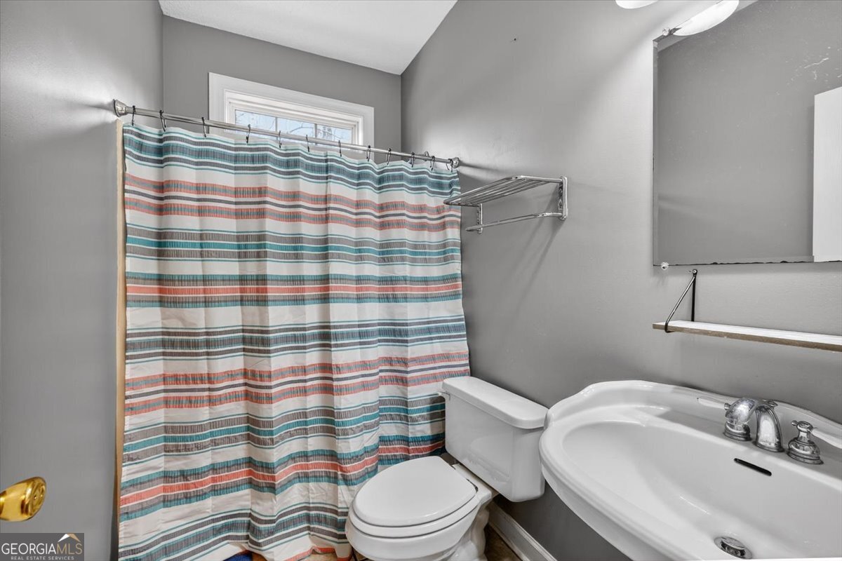 134 Royal Lane Gray, GA 31032 - Photo 22 of 31 a bathroom with a sink toilet and shower