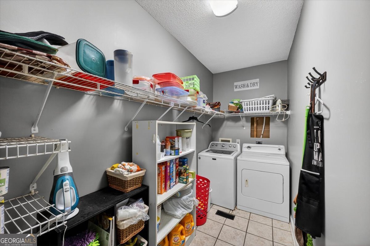 134 Royal Lane Gray, GA 31032 - Photo 25 of 31 a storage room with washer and dryer