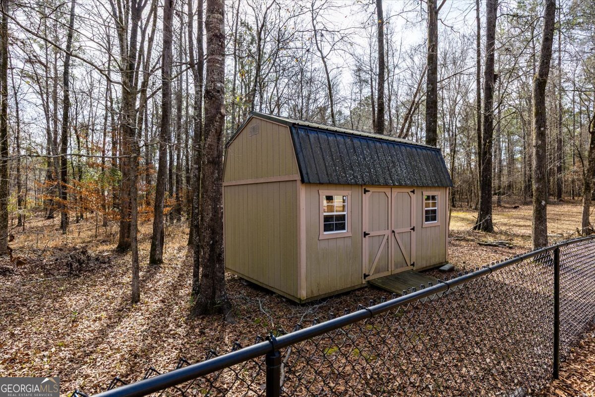 134 Royal Lane Gray, GA 31032 - Photo 30 of 31 a view of a backyard with wooden fence