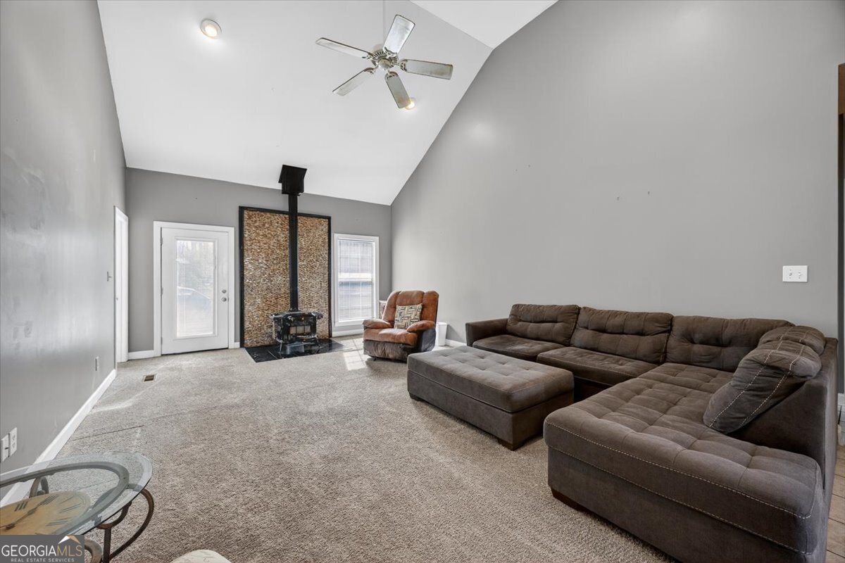 134 Royal Lane Gray, GA 31032 - Photo 4 of 31 a living room with furniture ceiling fan and a window