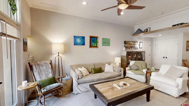 a living room with furniture and a table