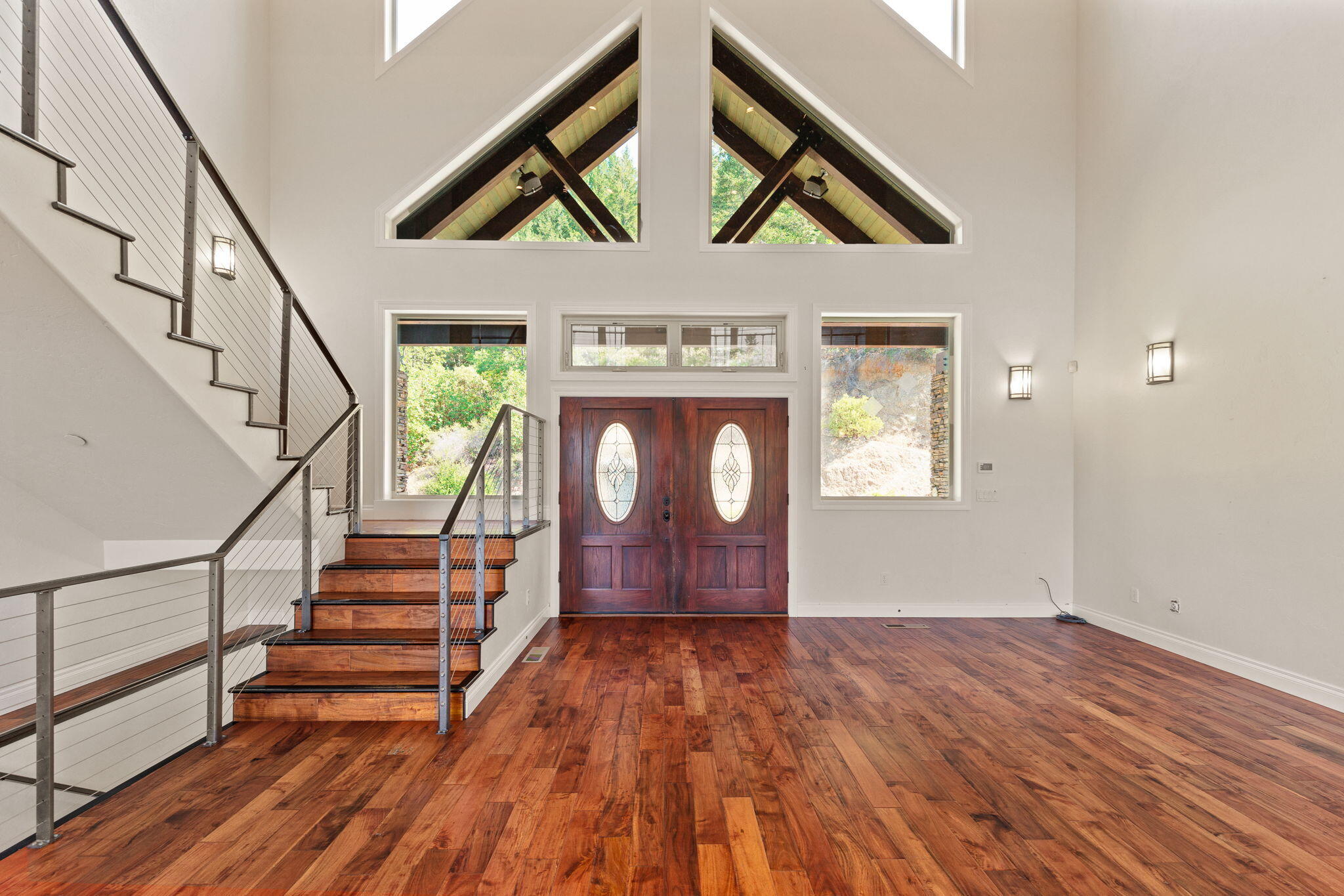 7304 North Applegate Road Grants Pass, OR 97527 - Photo 18 of 87 a view of entryway with stairs and wooden floor