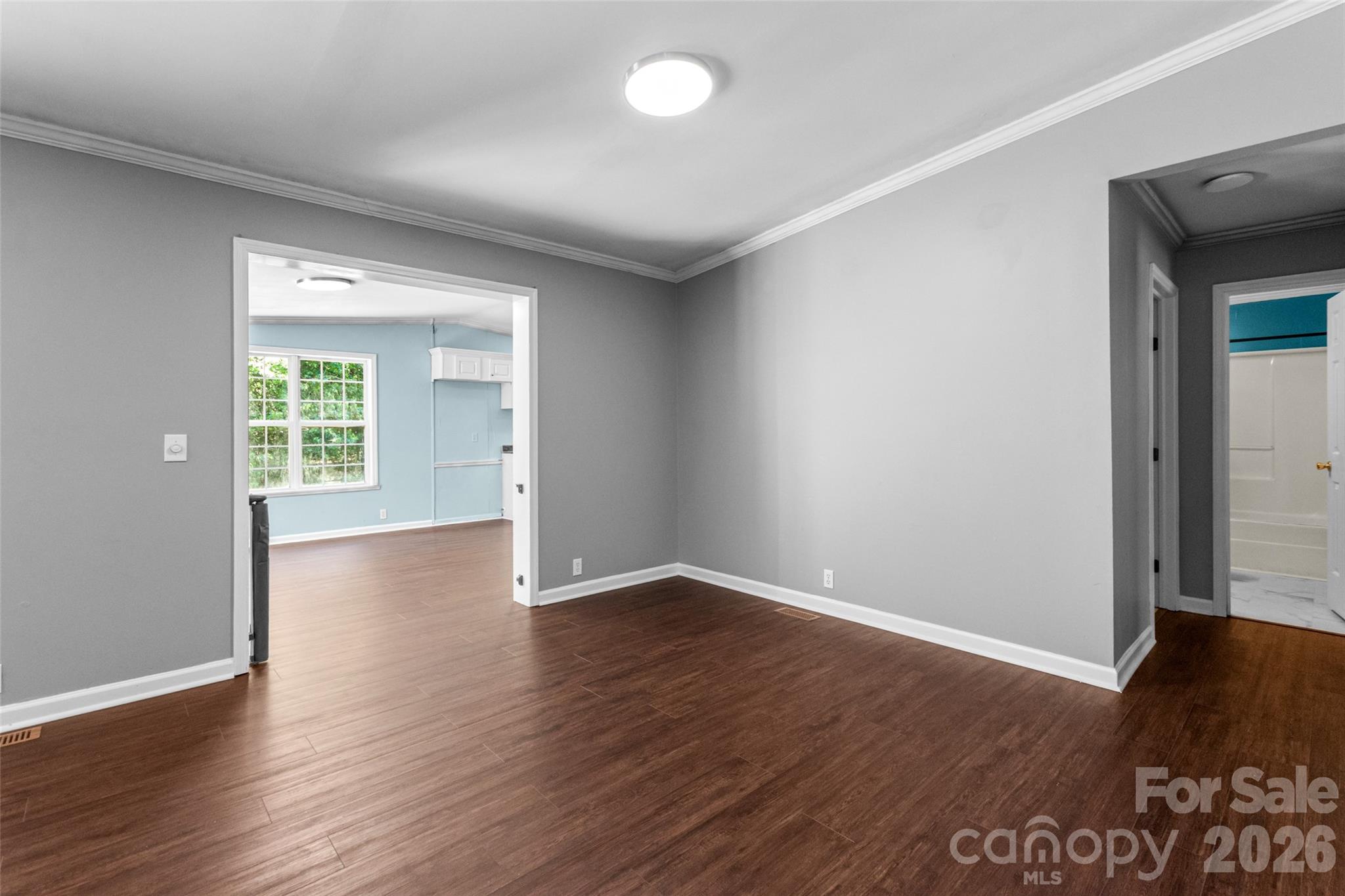 434 Rutledge Drive Catawba, SC 29704 - Photo 10 of 39 an empty room with wooden floor and windows