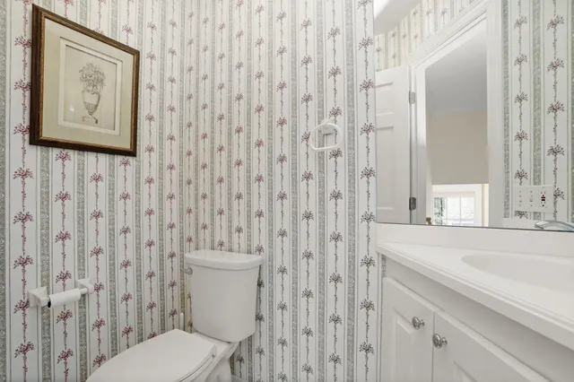 a bathroom with a toilet and a sink