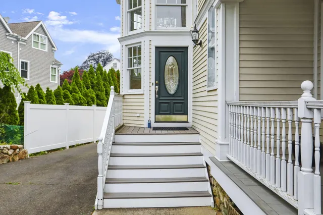a front view of a house with a white door