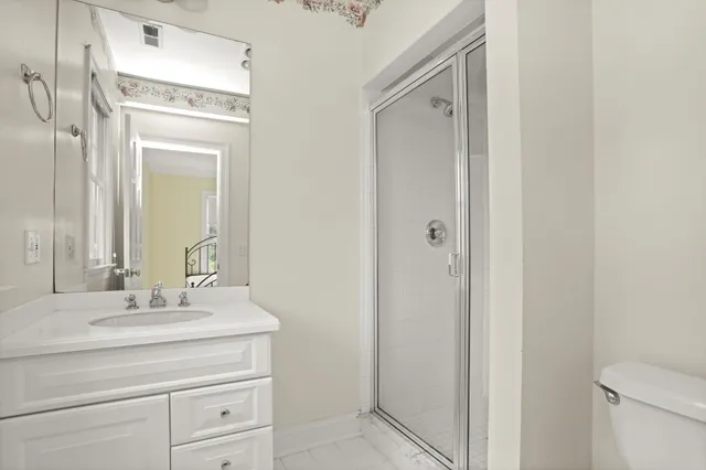 a bathroom with a sink vanity and a mirror