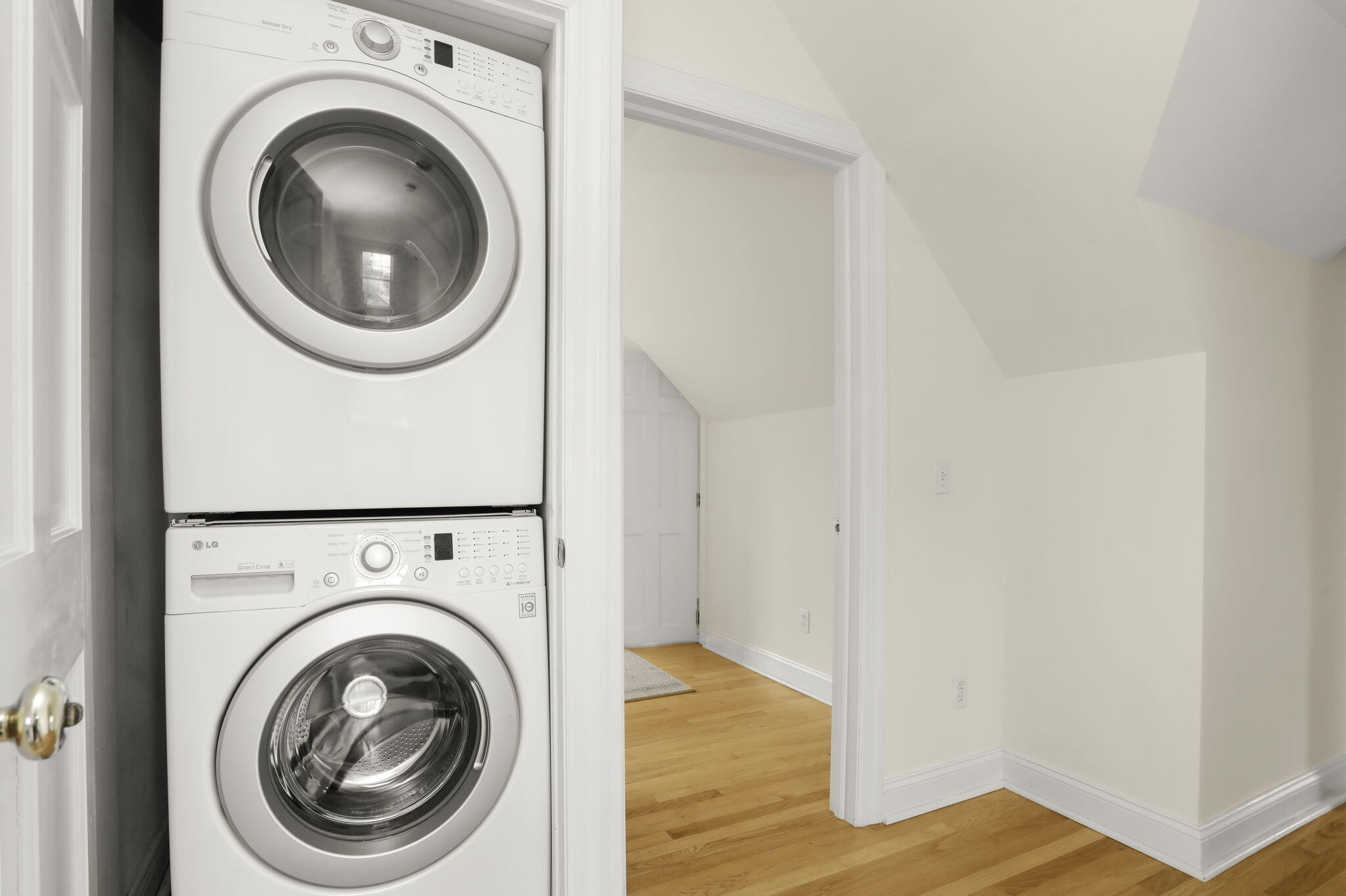190 Main Street, Unit B New Canaan, CT 06840 - Photo 22 of 32 a view of a hallway with washer and dryer