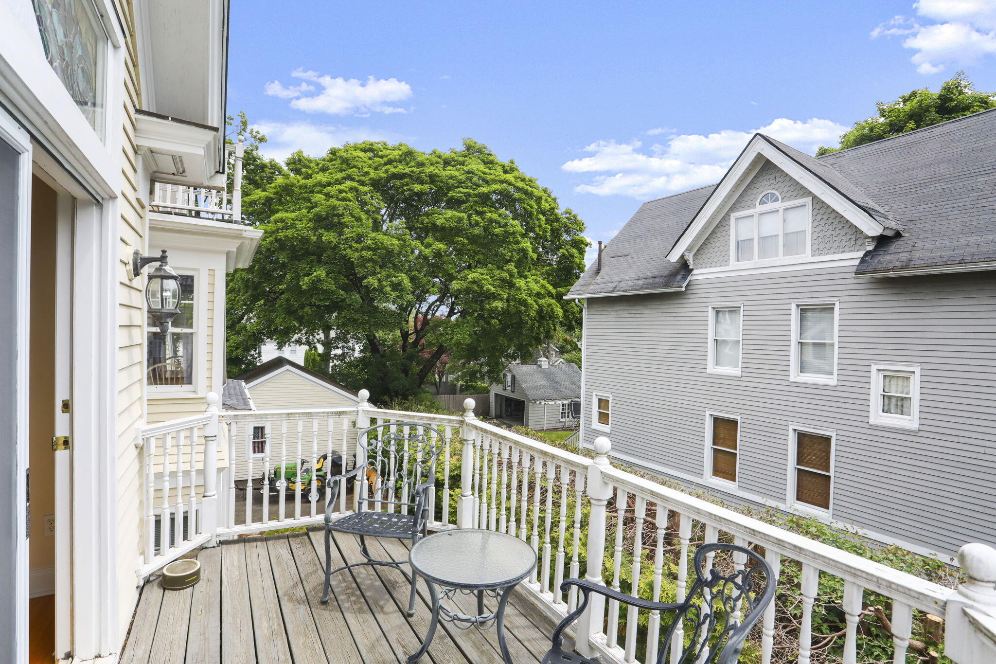 190 Main Street, Unit B New Canaan, CT 06840 - Photo 26 of 32 a view of a house with a wooden fence