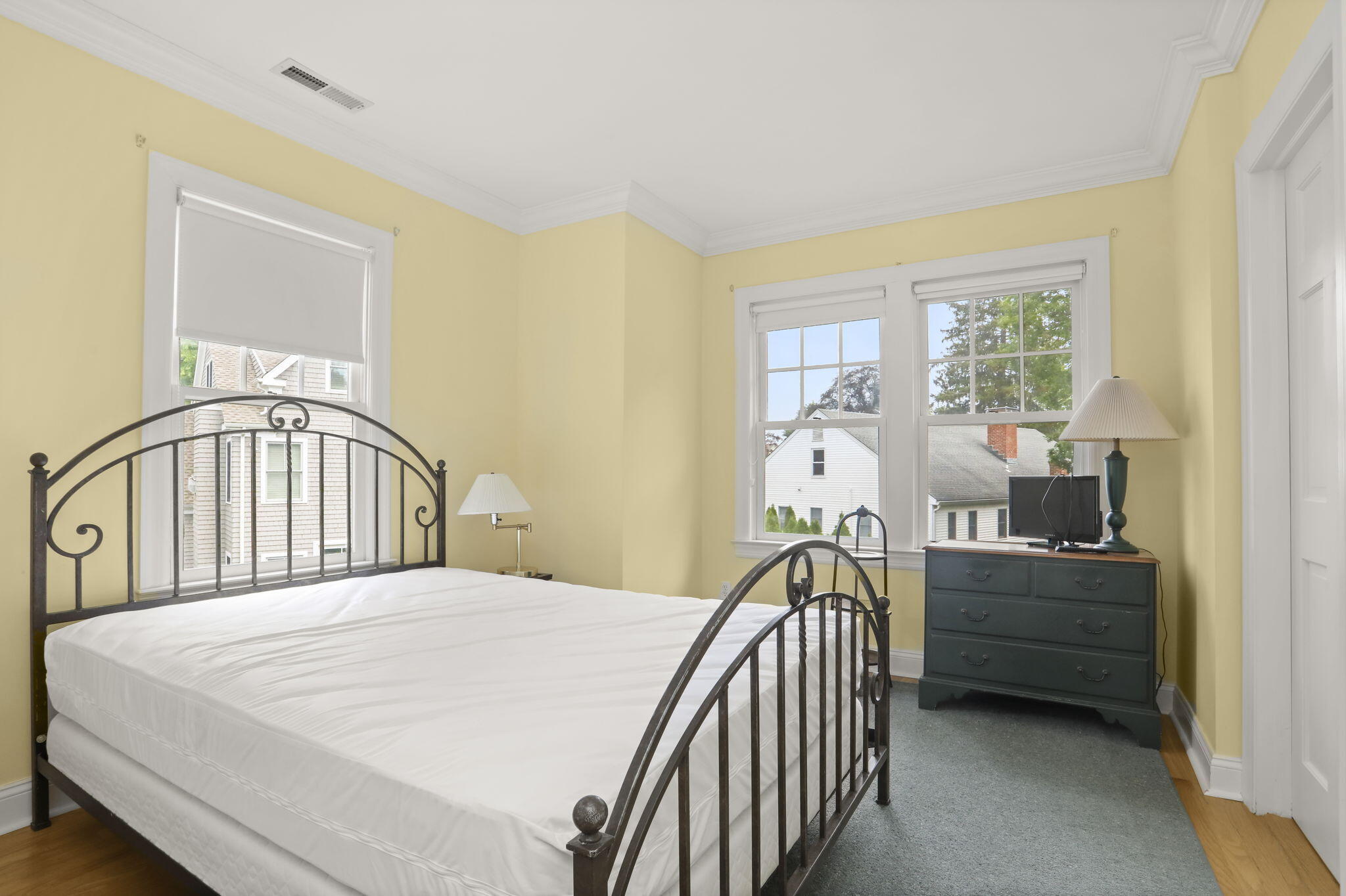 190 Main Street, Unit B New Canaan, CT 06840 - Photo 8 of 32 a bedroom with a bed next to a window