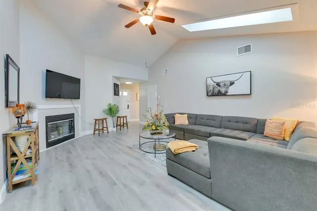a view of a livingroom with furniture and a fireplace