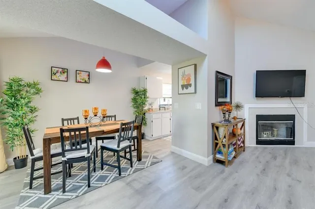 a bathroom with a granite countertop toilet sink and mirror