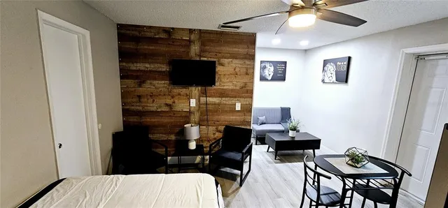 a bedroom with a bed and a mirror