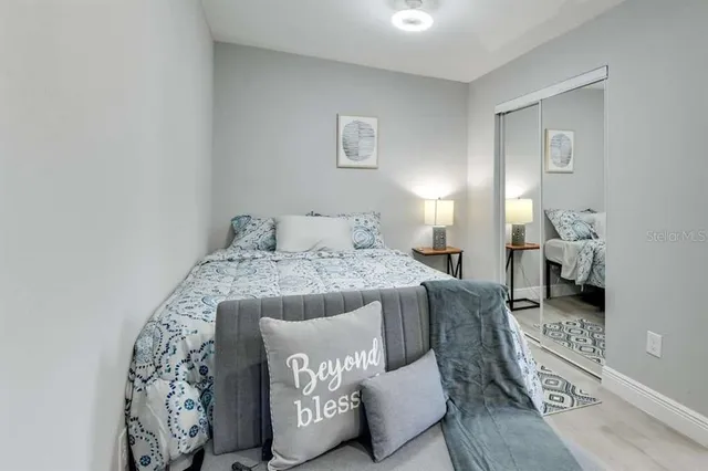 a bedroom with a bed and a couch