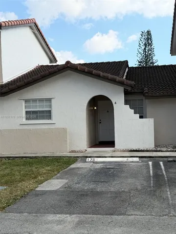 a front view of a house with garage