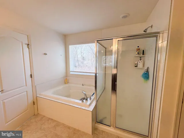 a very nice looking living room with dining room and wooden floor