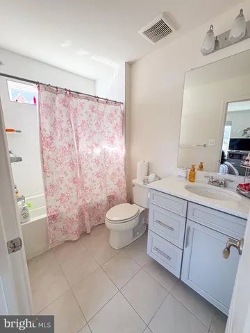 a bedroom with a bed and cabinets