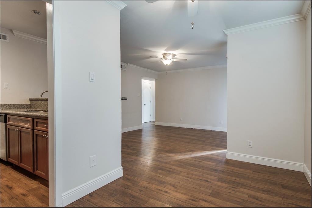 3907 Gilbert Avenue, Unit 3 Dallas, TX 75219 - Photo 5 of 9 a view of empty room with wooden floor