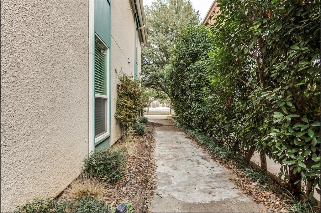 3907 Gilbert Avenue, Unit 3 Dallas, TX 75219 - Photo 8 of 9 a pathway of a house with a yard