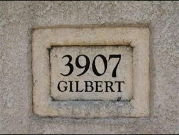 3907 Gilbert Avenue, Unit 3 Dallas, TX 75219 - Photo 9 of 9 a wall with a sign