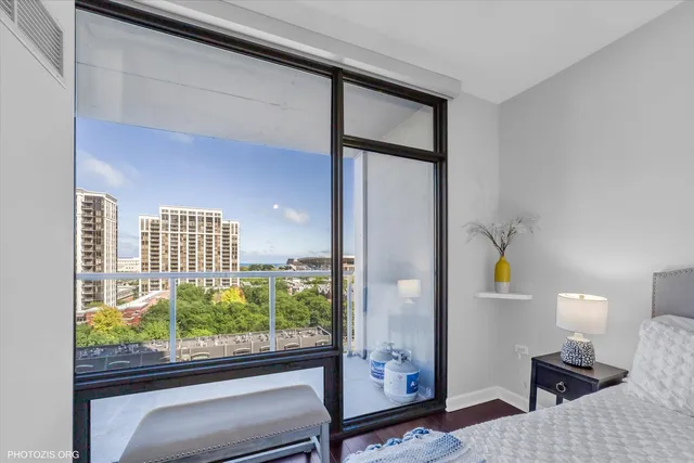 a bedroom with bed and a window