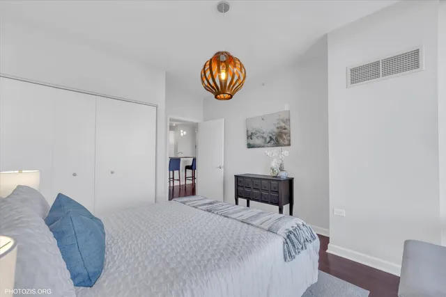 a bedroom with a bed and a table in it