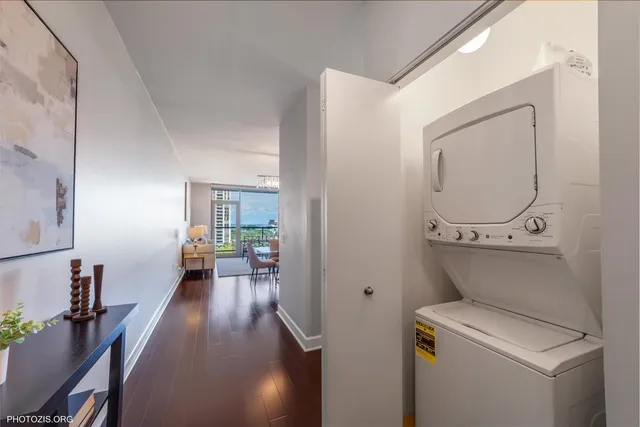 a view of a hallway with workspace and a window