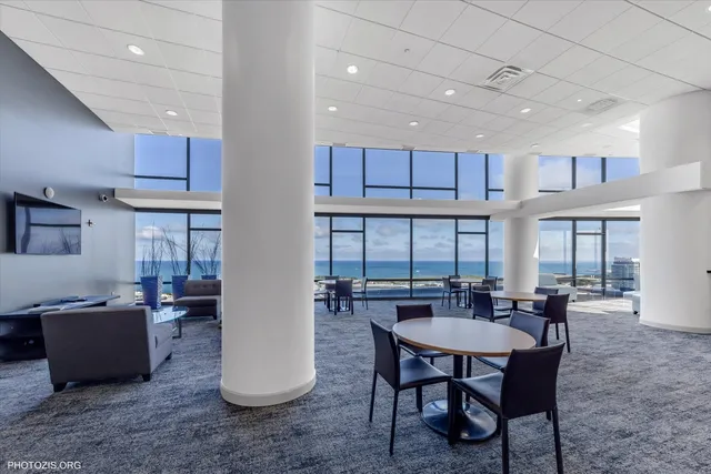 a large kitchen with lots of counter top space and stainless steel appliances