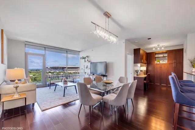 a view of a dining room with furniture window and wooden floor