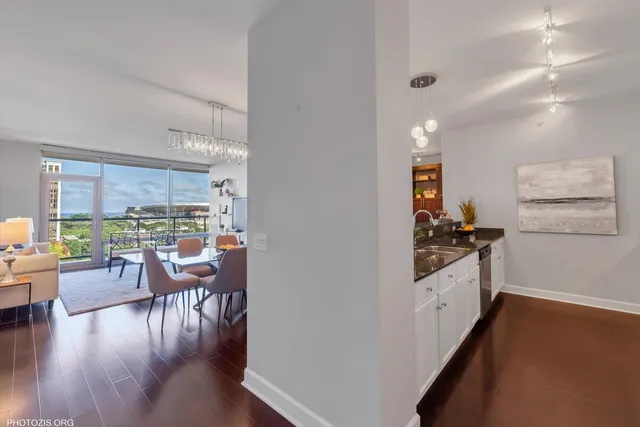 a kitchen with lots of counter top space and wooden floor
