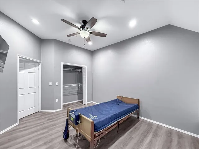 a living room with a bed furniture and a window