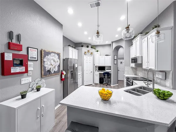 a view of a kitchen and a sink