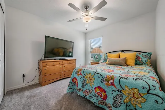 a swimming pool with outdoor seating and city view