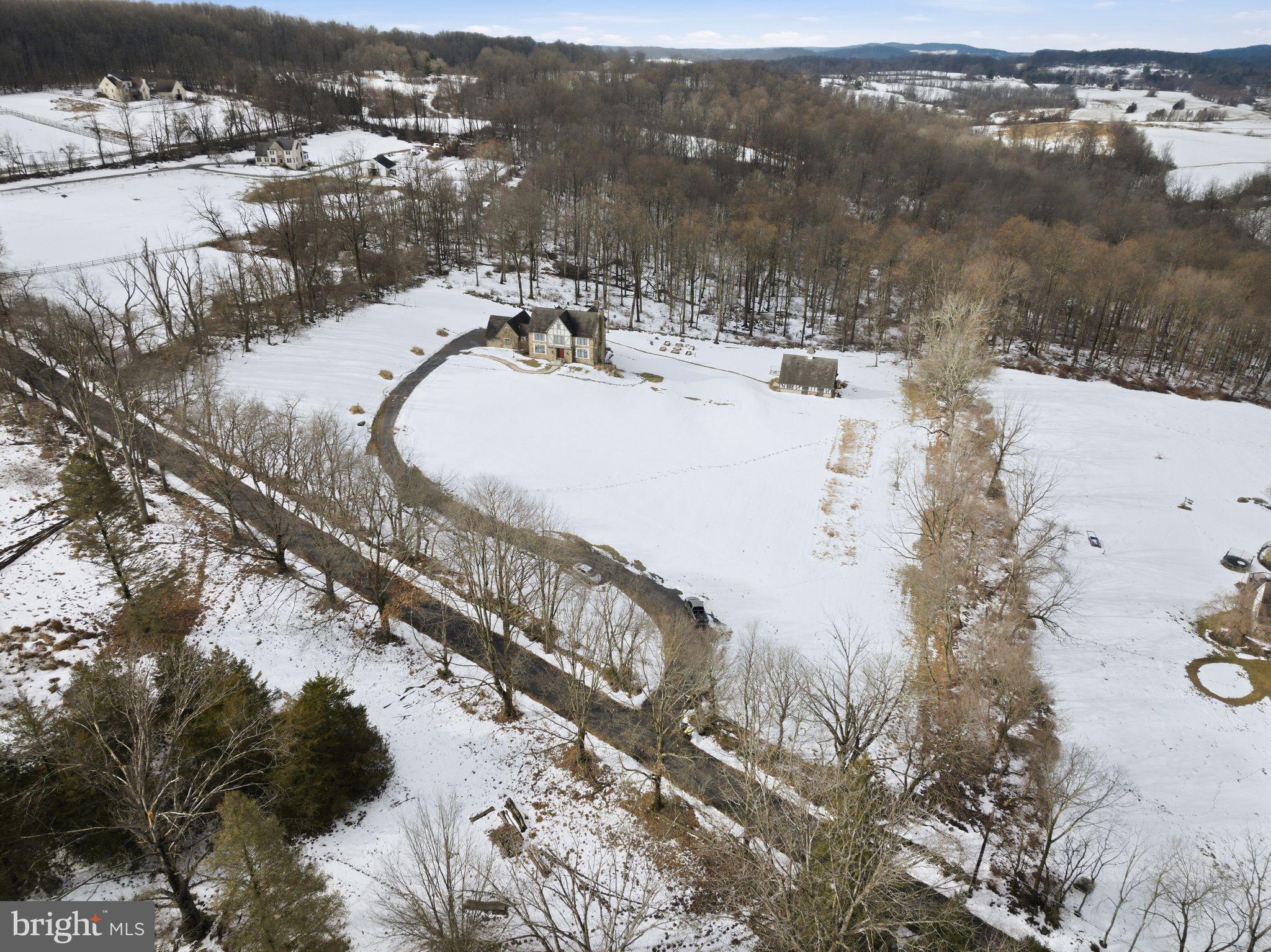 231 Hill Road Elverson, PA 19520 - Photo 1 of 60 a view of a lake with a mountain