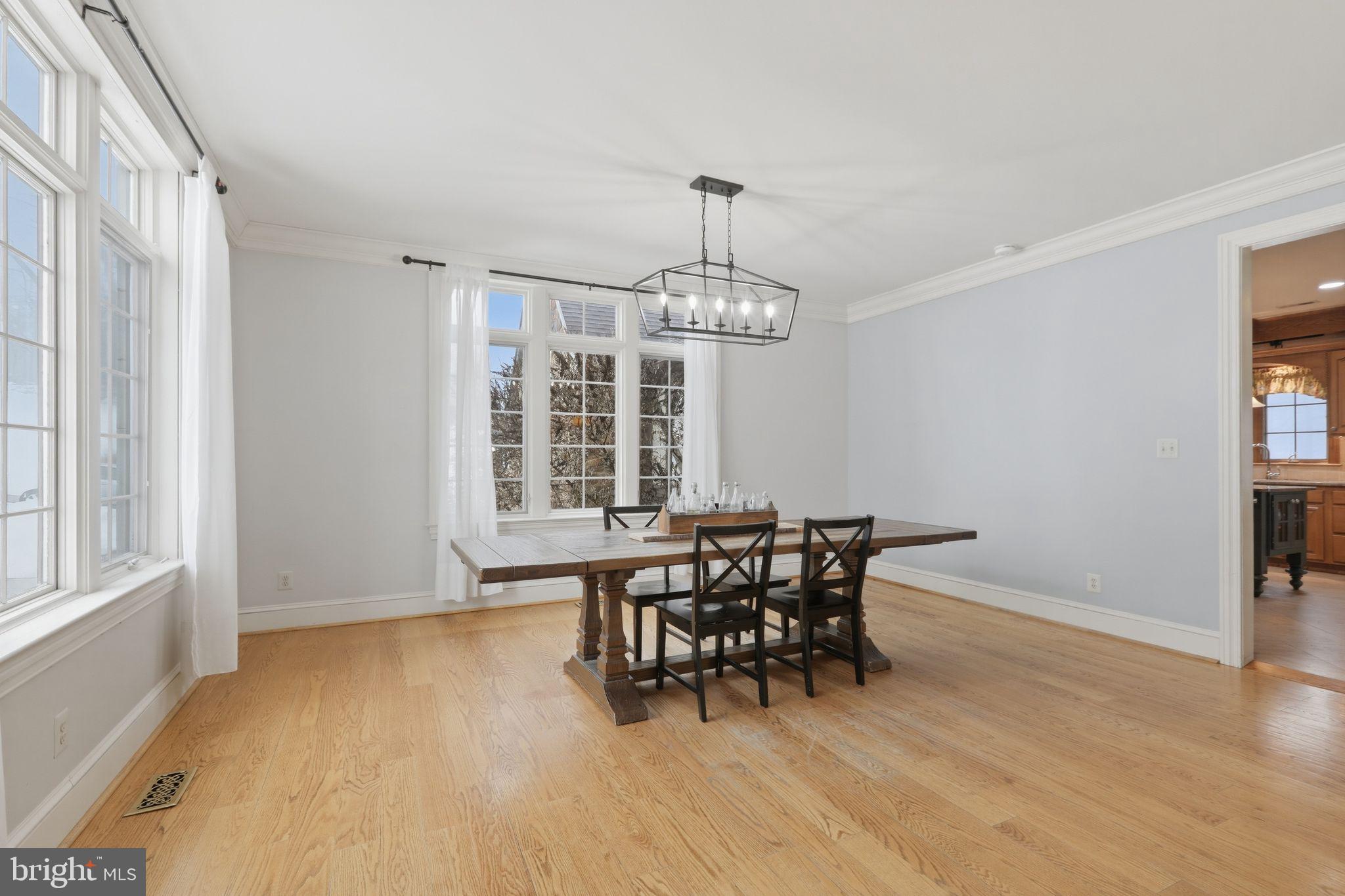231 Hill Road Elverson, PA 19520 - Photo 12 of 60 a view of a dining room with furniture and chandelier