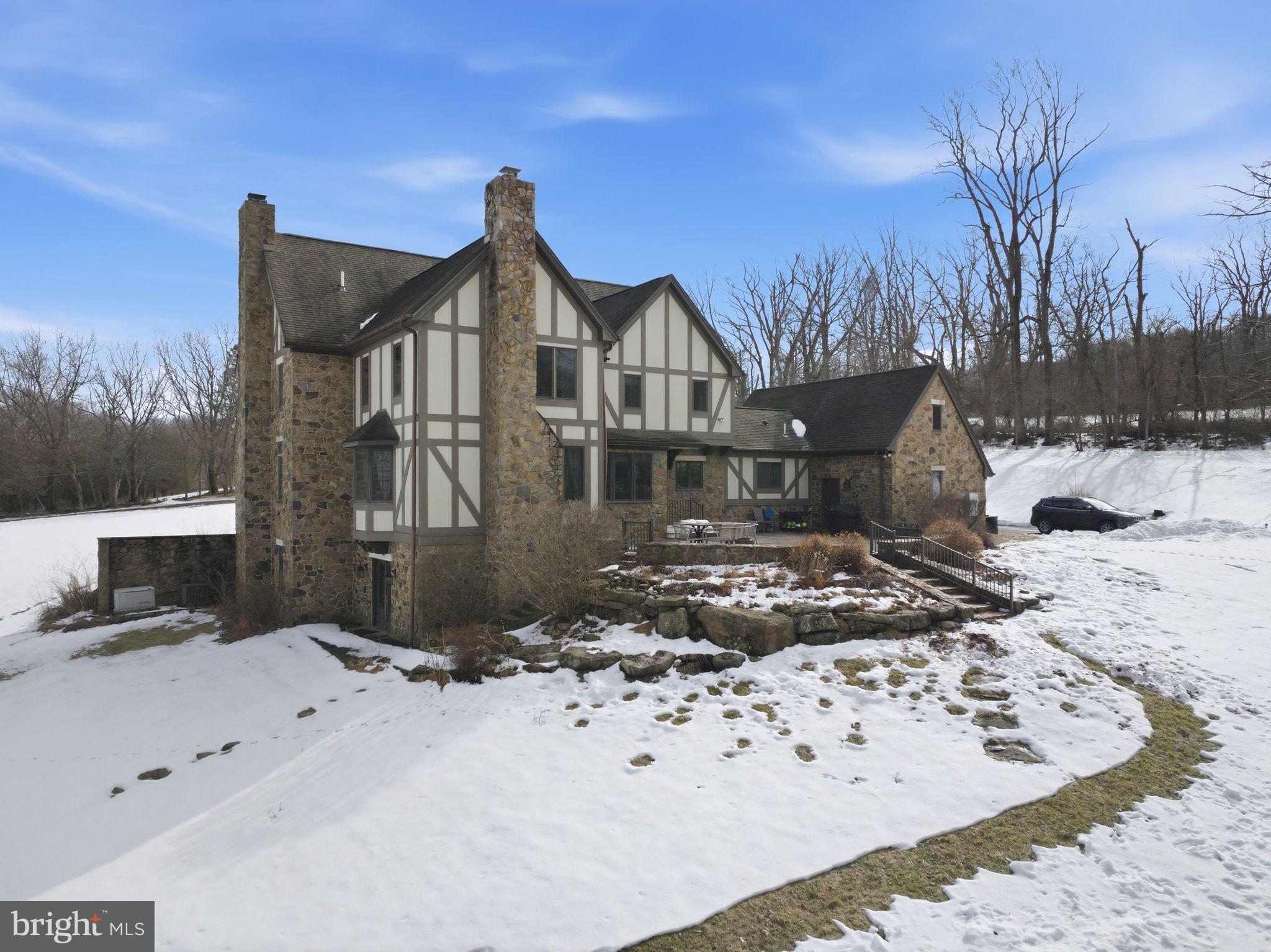 231 Hill Road Elverson, PA 19520 - Photo 2 of 60 a view of a house with a yard covered in snow