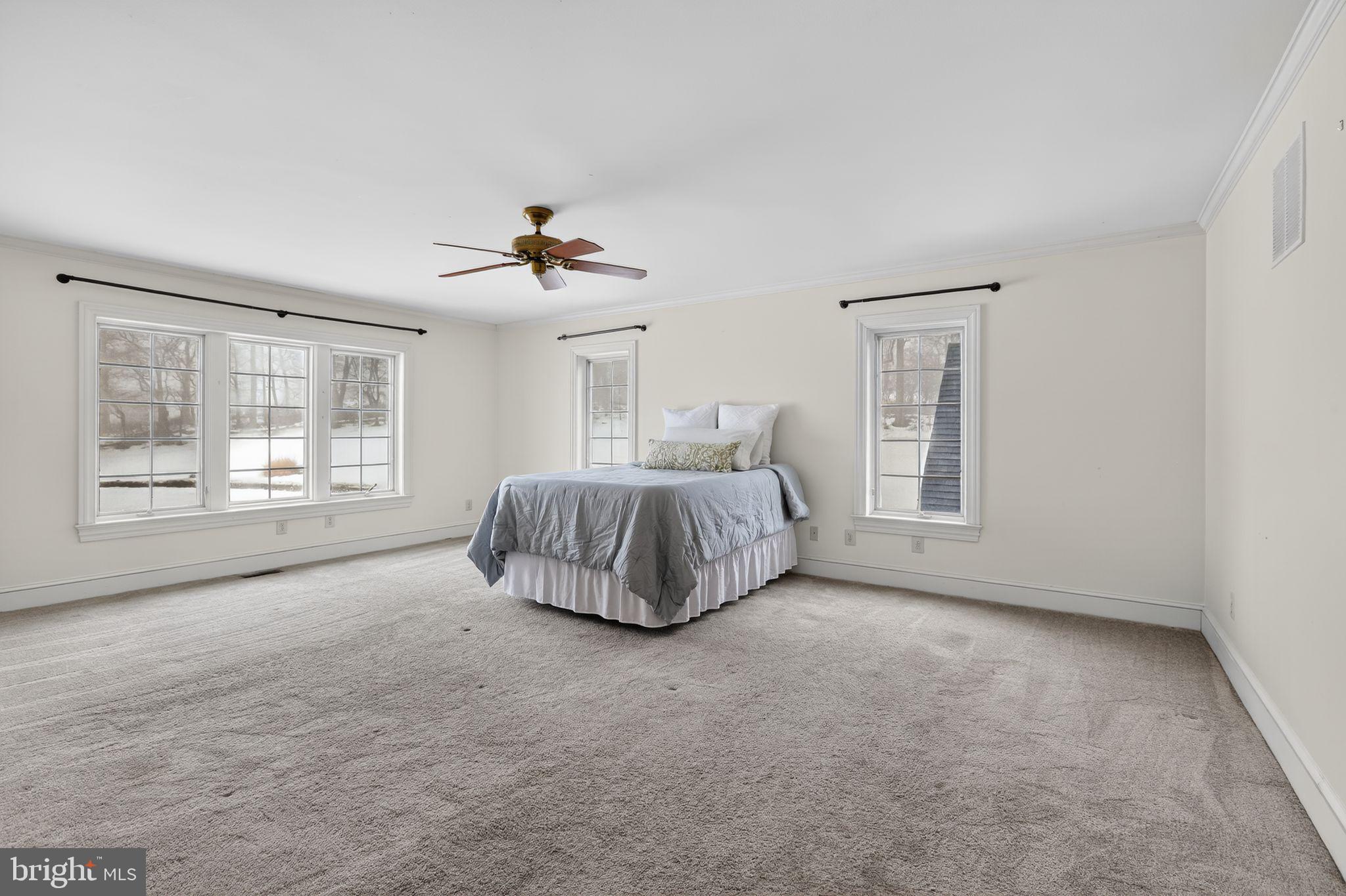 231 Hill Road Elverson, PA 19520 - Photo 33 of 60 a spacious bedroom with a bed and a window