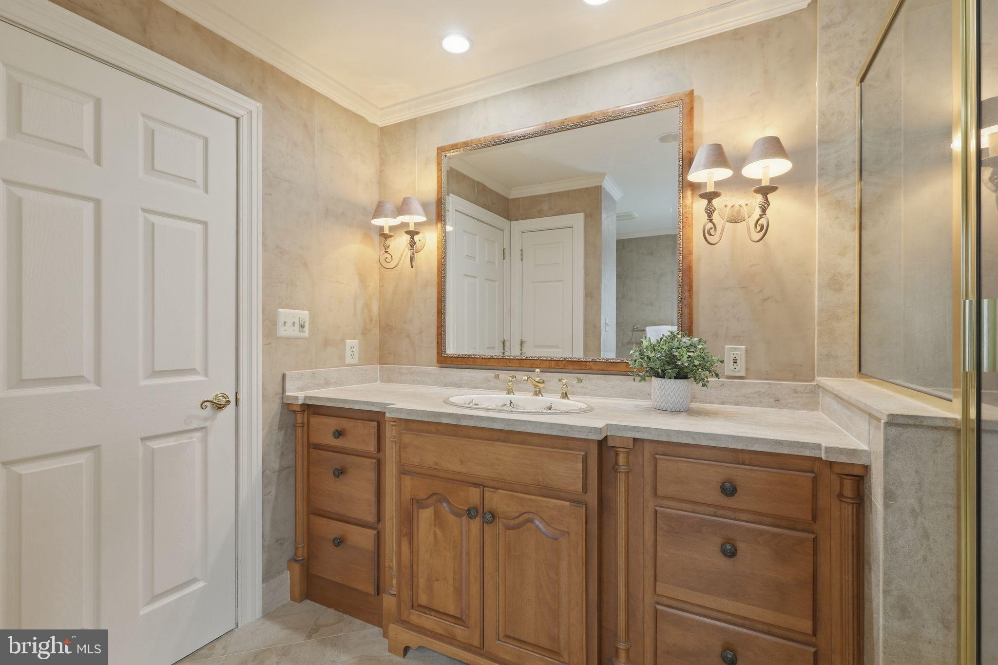 231 Hill Road Elverson, PA 19520 - Photo 34 of 60 a bathroom with a granite countertop sink and a mirror