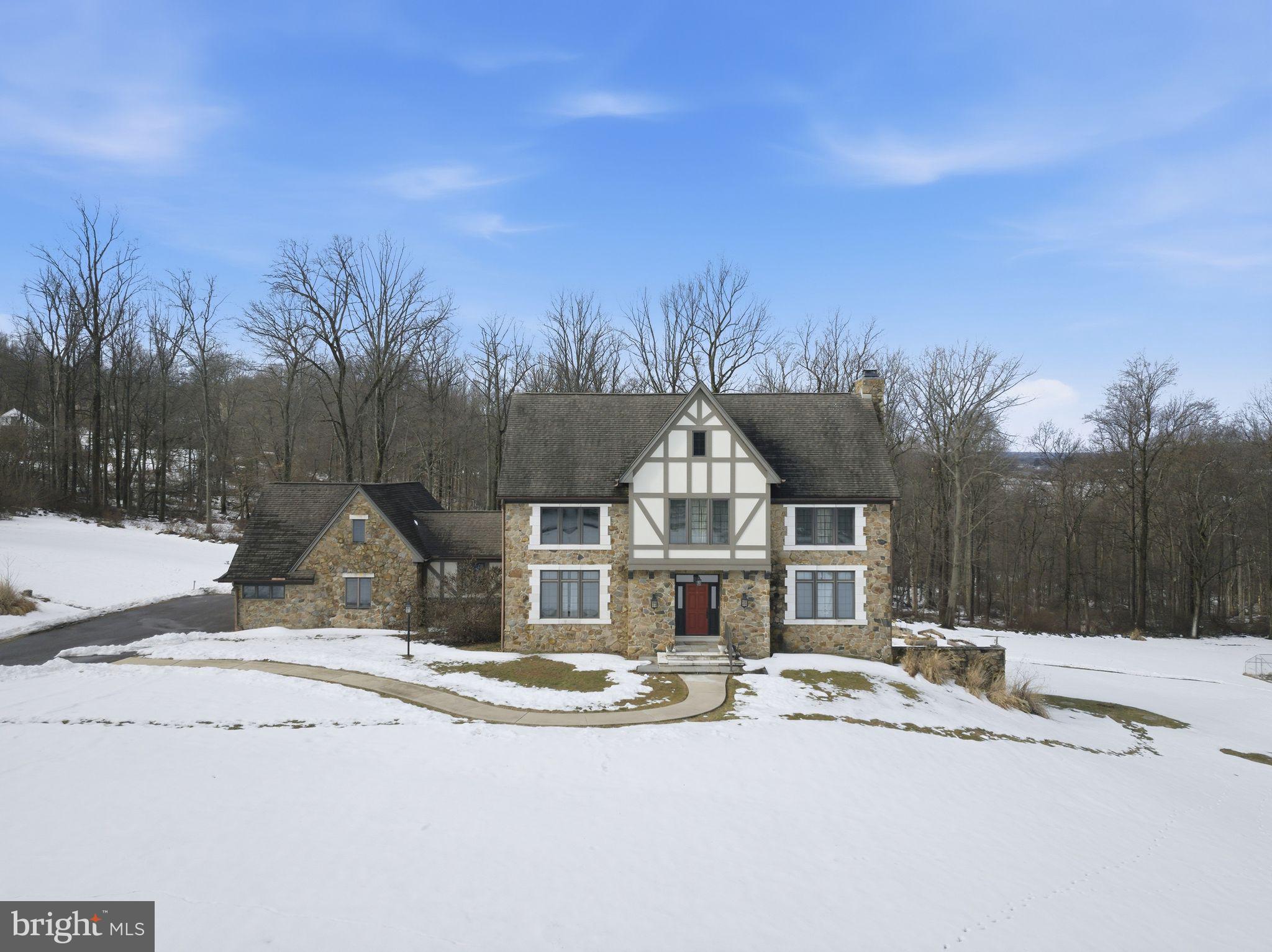231 Hill Road Elverson, PA 19520 - Photo 4 of 60 a view of a white house with a yard covered in snow