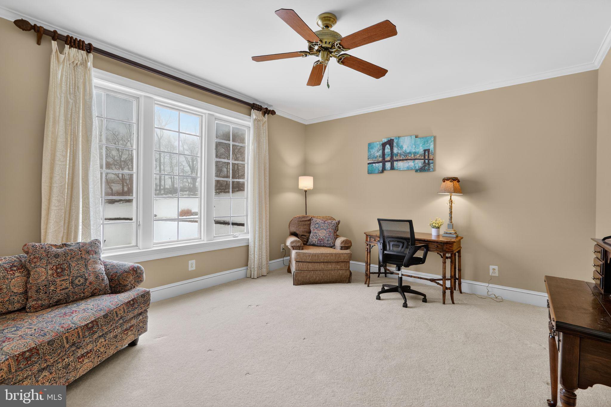 231 Hill Road Elverson, PA 19520 - Photo 42 of 60 a living room with furniture and a large window with a bookshelf