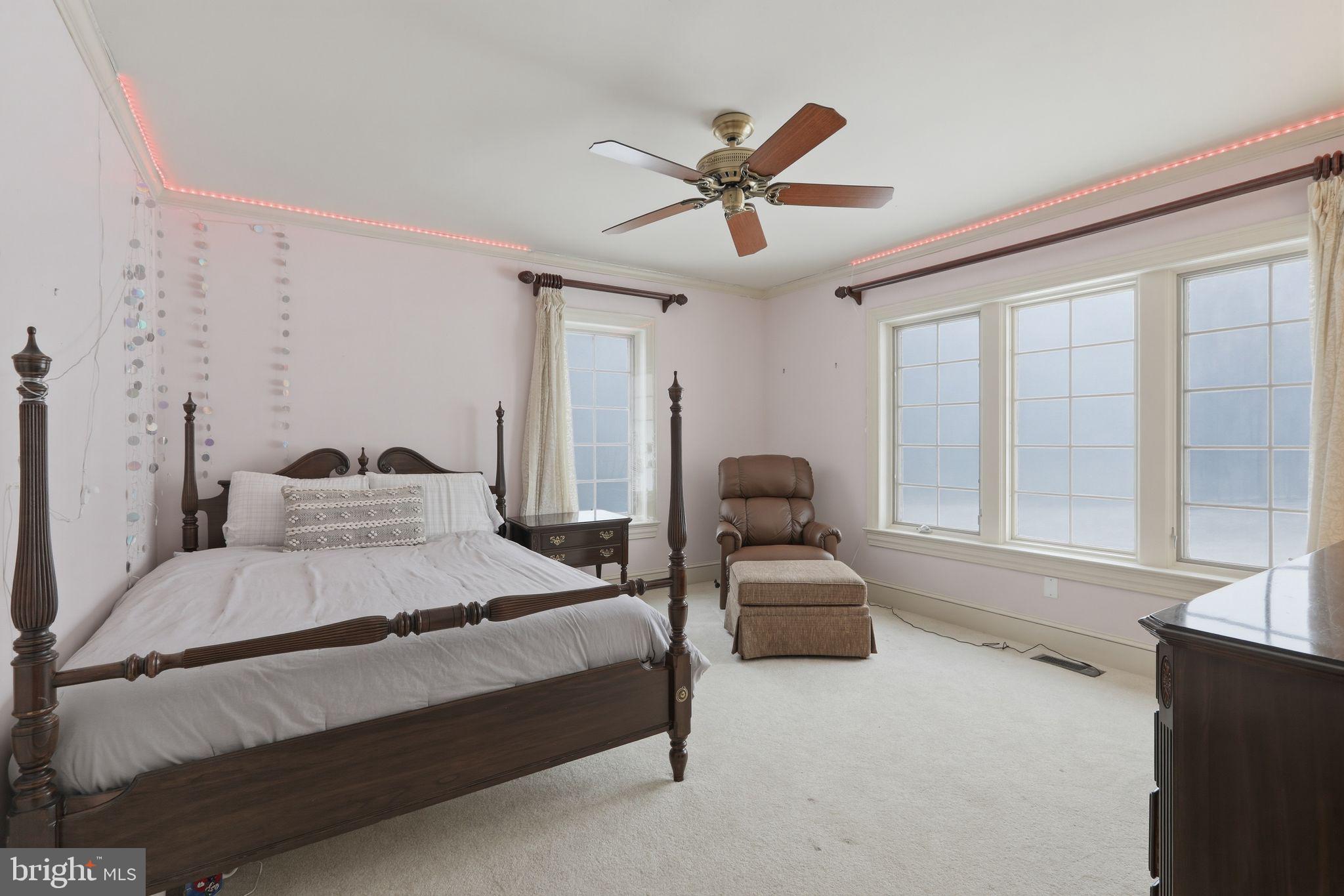231 Hill Road Elverson, PA 19520 - Photo 44 of 60 a spacious bedroom with a bed and window