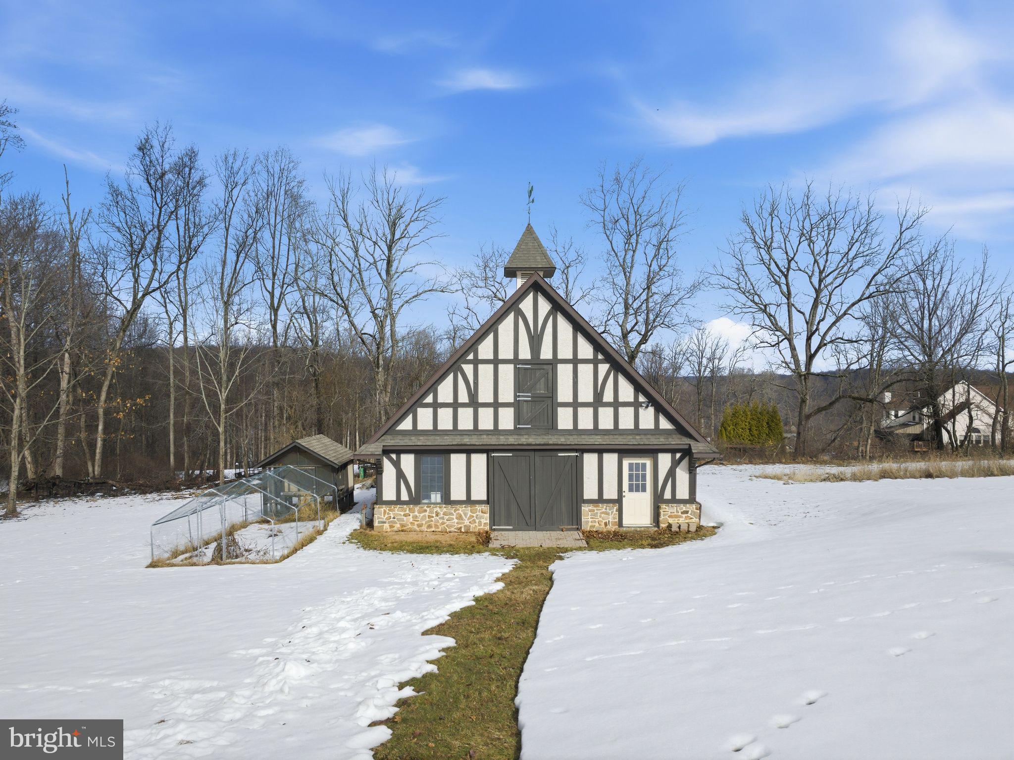 231 Hill Road Elverson, PA 19520 - Photo 53 of 60 a view of a house with a yard covered with snow in center