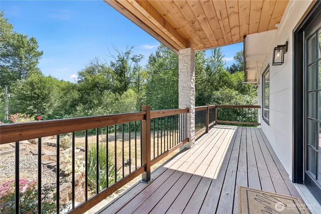 a view of balcony with wooden floor