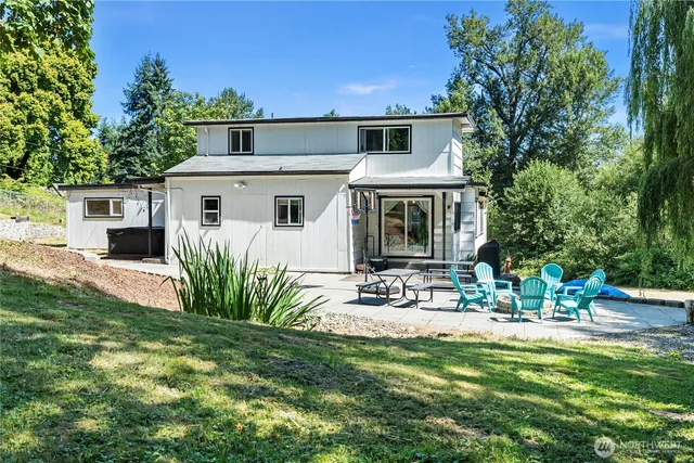 a view of yard with seating area and trees around
