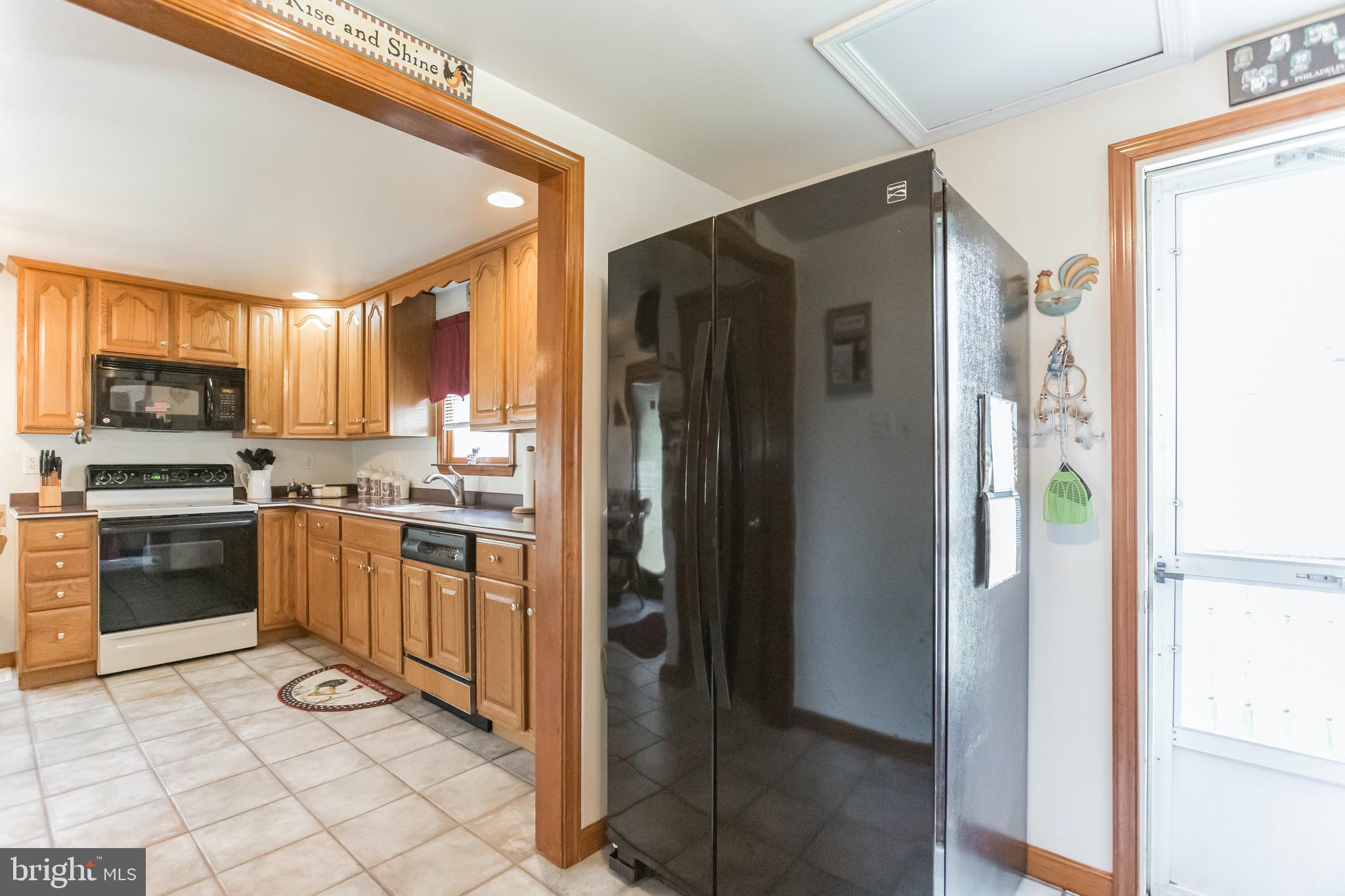 725 Thorndale Road Aldan, PA 19018 - Photo 16 of 30 New refrigerator and entry to side yard