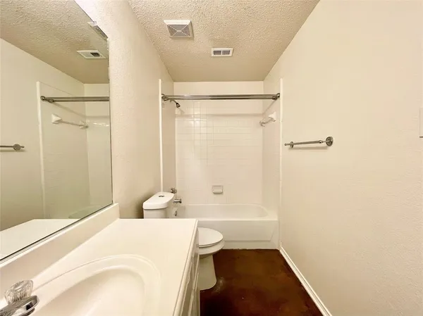 a bathroom with a granite countertop sink and a large mirror