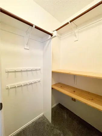 a bathroom with a shower and a table