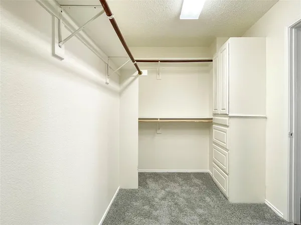 a view of an empty walk in closet