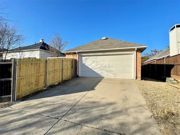 a view of a front of a house with a garage