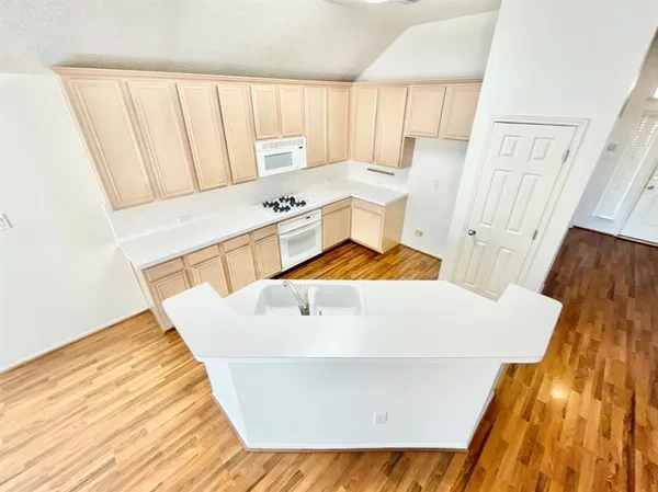 a bathroom with a sink and a window