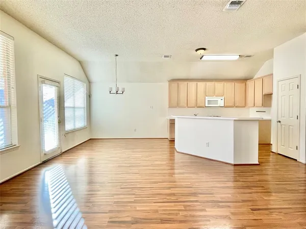 a view of kitchen with wooden floor